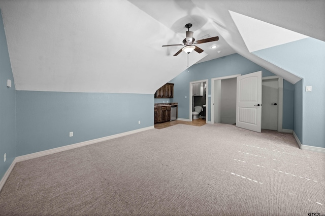 bonus room featuring light colored carpet, ceiling fan, and vaulted ceiling