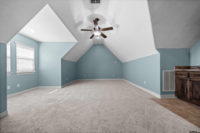 21882 Syrah Dr, Tyler, TX 75703 - bonus room featuring a ceiling fan, carpet floors, baseboards, and vaulted ceiling