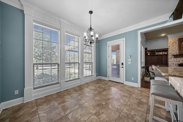 unfurnished dining area featuring plenty of natural light, a notable chandelier, light tile patterned floors, and crown molding