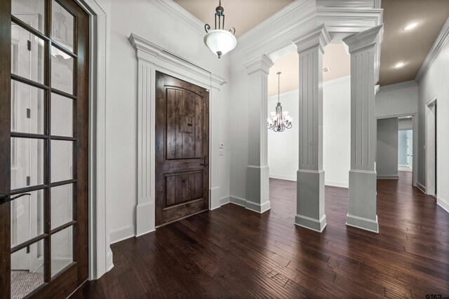 21882 Syrah Dr, Tyler, TX 75703 - entrance foyer featuring decorative columns, wood-type flooring, baseboards, a chandelier, and crown molding