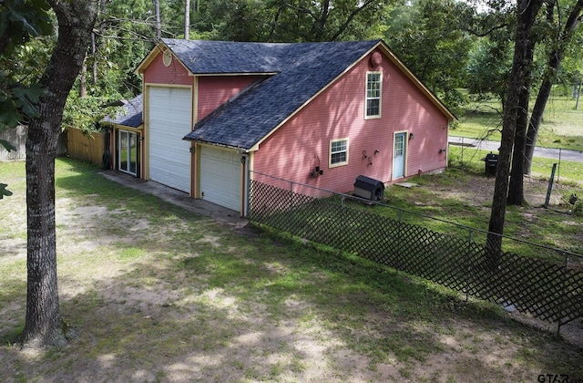 811 Janis, Bullard, TX 75757 - view of side of home with a shingled roof, a garage, and driveway