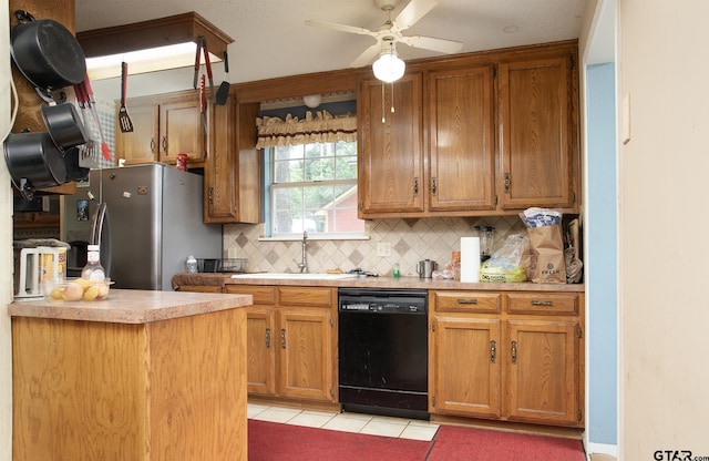 811 Janis, Bullard, TX 75757 - kitchen featuring black dishwasher, freestanding refrigerator, light tile patterned flooring, backsplash, and light countertops