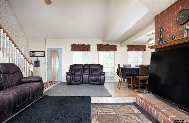 811 Janis, Bullard, TX 75757 - living area featuring wallpapered walls, stairway, high vaulted ceiling, and tile patterned flooring