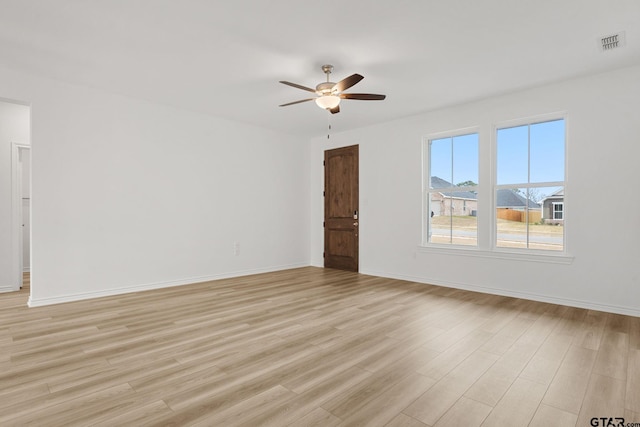 unfurnished room featuring ceiling fan and light wood-type flooring