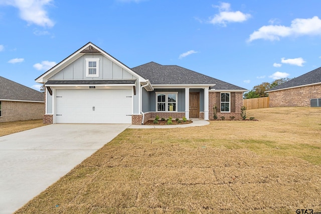 view of front of property featuring a garage and a front yard