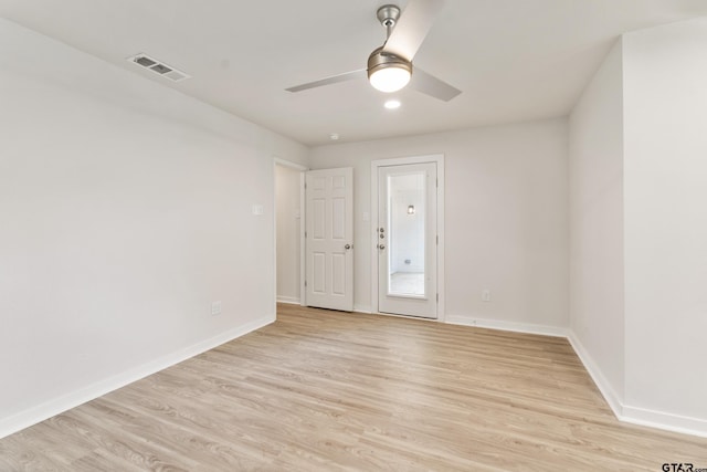 empty room featuring ceiling fan and light hardwood / wood-style floors