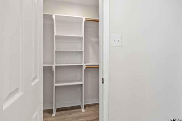 walk in closet featuring hardwood / wood-style floors