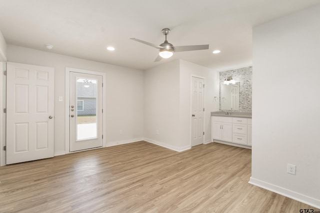 interior space featuring ceiling fan and light hardwood / wood-style floors