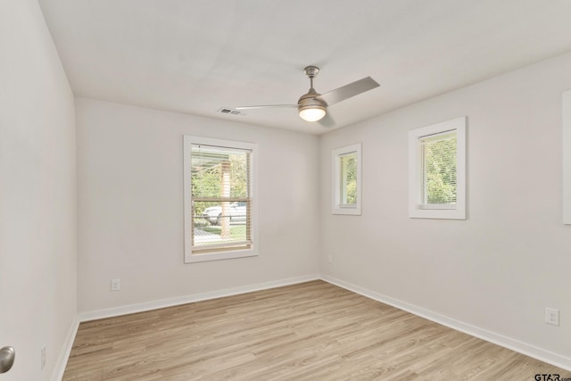 spare room featuring ceiling fan and light hardwood / wood-style floors