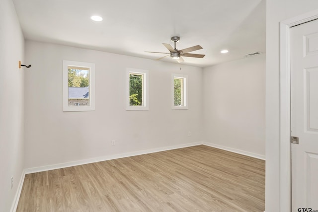 unfurnished room with ceiling fan and light hardwood / wood-style flooring