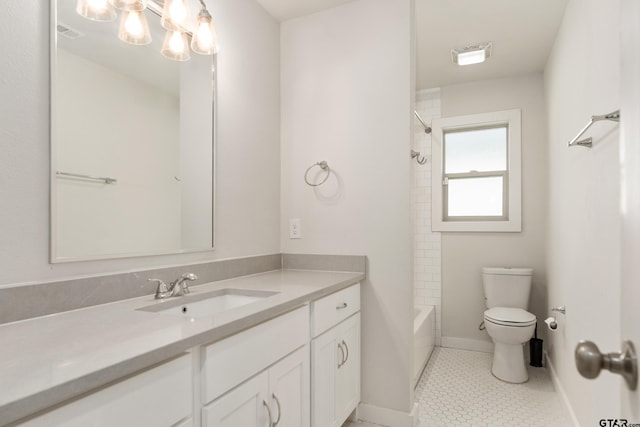 full bathroom with toilet, vanity, tile patterned flooring, and tiled shower / bath