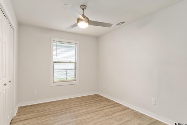 spare room with ceiling fan and light hardwood / wood-style floors