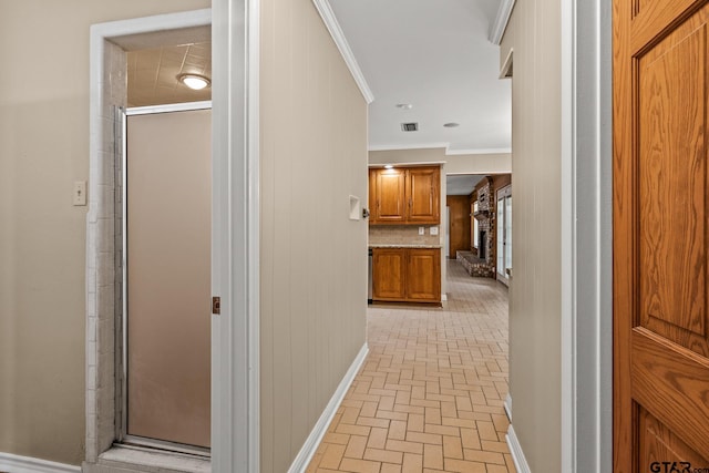 1108 Quitman, Pittsburg, TX 75686 - corridor with brick patterned flooring, ornamental molding, and baseboards