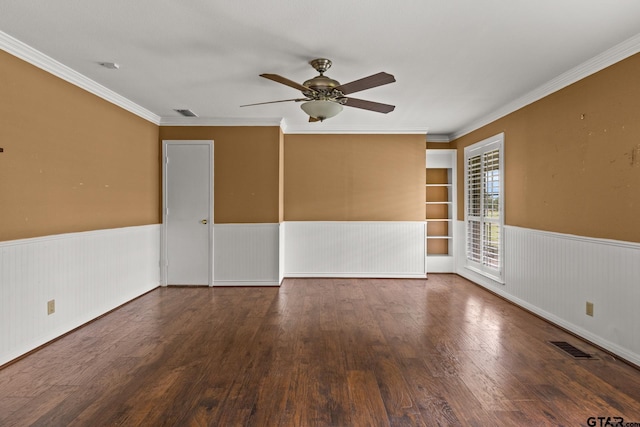1108 Quitman, Pittsburg, TX 75686 - empty room featuring wainscoting, ceiling fan, wood finished floors, and crown molding