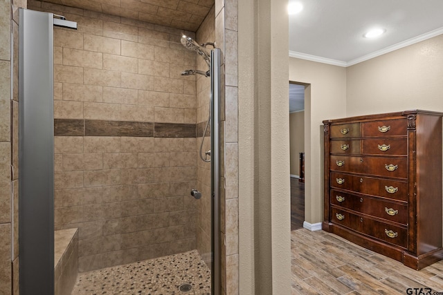 1108 Quitman, Pittsburg, TX 75686 - full bath featuring crown molding, a shower stall, and wood finished floors