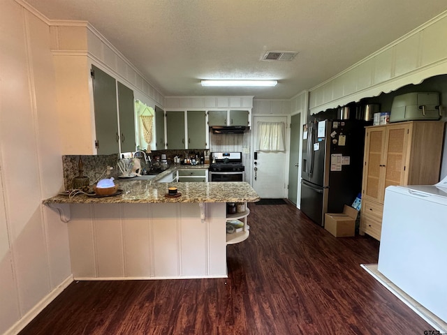 kitchen featuring kitchen peninsula, light stone countertops, dark wood-type flooring, and appliances with stainless steel finishes