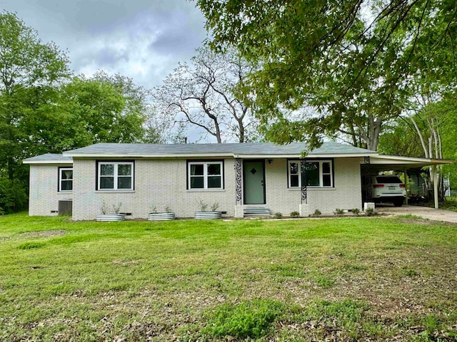 single story home featuring a front yard and a carport