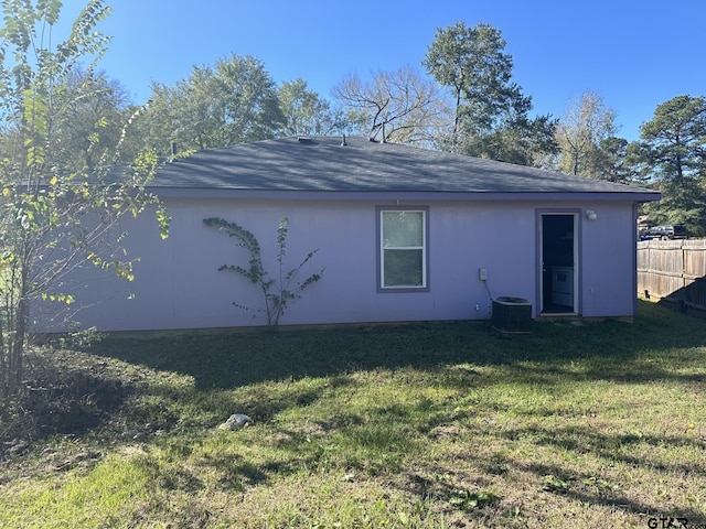 10250 Peterson Rd, Tyler, TX 75708 - rear view of house with a shingled roof and central air condition unit