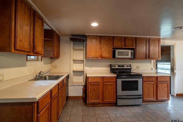 19748 Northside Dr, Winona, TX 75792 - kitchen featuring stainless steel appliances, open shelves, light tile patterned floors, brown cabinetry, and light countertops
