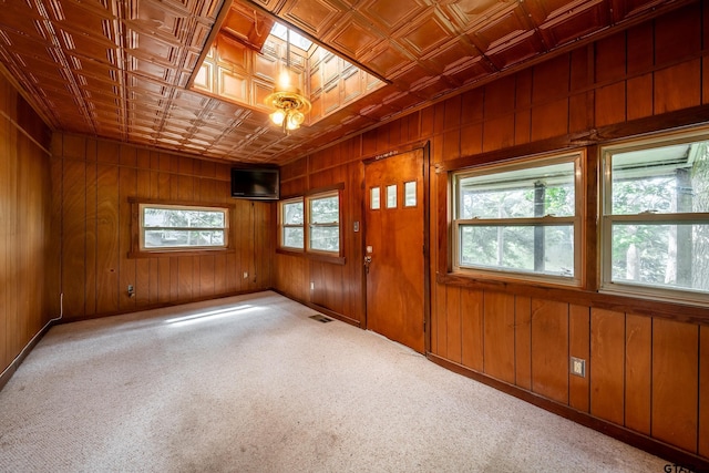 19748 Northside Dr, Winona, TX 75792 - carpeted entryway with an ornate ceiling and wood walls
