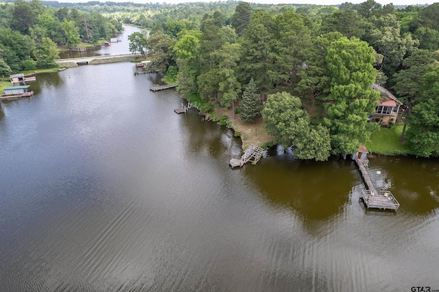 19748 Northside Dr, Winona, TX 75792 - drone / aerial view of a nearby body of water and a heavily wooded area