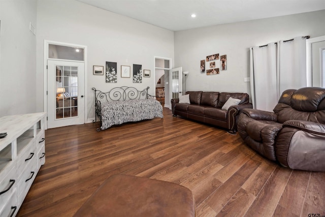 living room with dark hardwood / wood-style floors and french doors