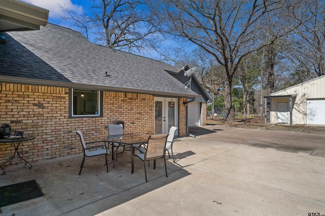 view of patio / terrace featuring a garage