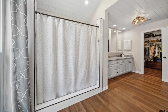 bathroom with hardwood / wood-style flooring, vanity, vaulted ceiling, and wooden ceiling