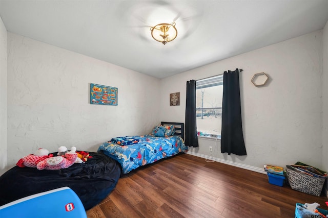 bedroom featuring dark hardwood / wood-style floors