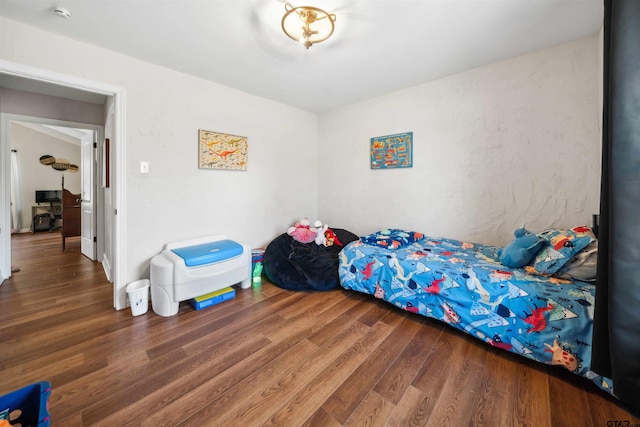 bedroom featuring hardwood / wood-style flooring