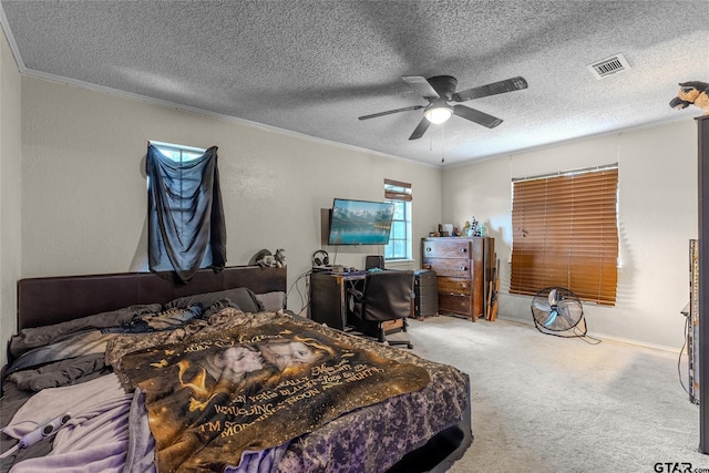 1304 Azalea Dr, Sulphur Springs, TX 75482 - carpeted bedroom with ornamental molding, a textured ceiling, a ceiling fan, and a desk