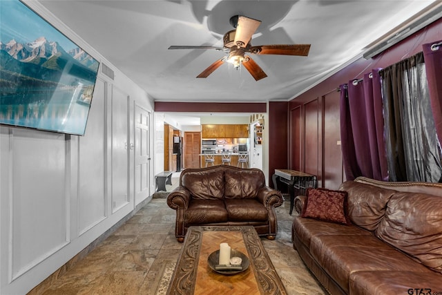 1304 Azalea Dr, Sulphur Springs, TX 75482 - living area featuring ceiling fan and stone finish floors