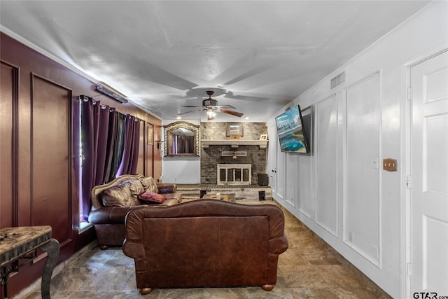 1304 Azalea Dr, Sulphur Springs, TX 75482 - living room featuring a ceiling fan, a large fireplace, and a decorative wall