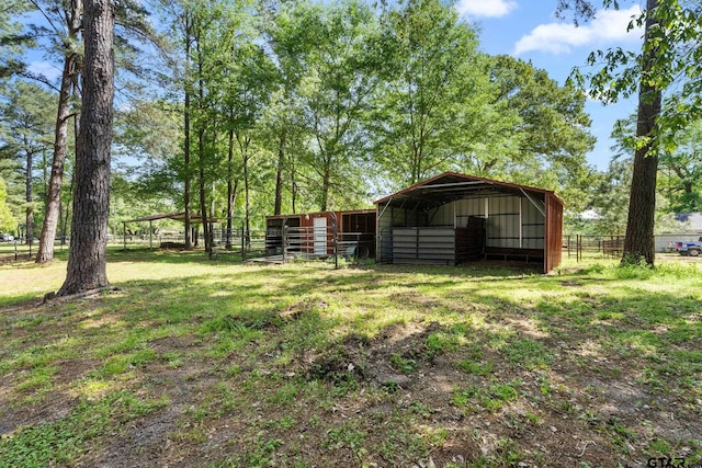 19132 Falls Creek Dr, Flint, TX 75762 - view of yard featuring an exterior structure, fence, an outbuilding, and a pole building