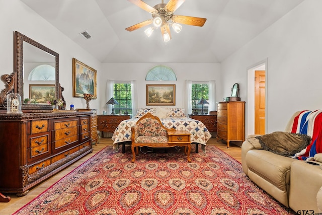 19132 Falls Creek Dr, Flint, TX 75762 - bedroom with light wood finished floors, vaulted ceiling, visible vents, and multiple windows