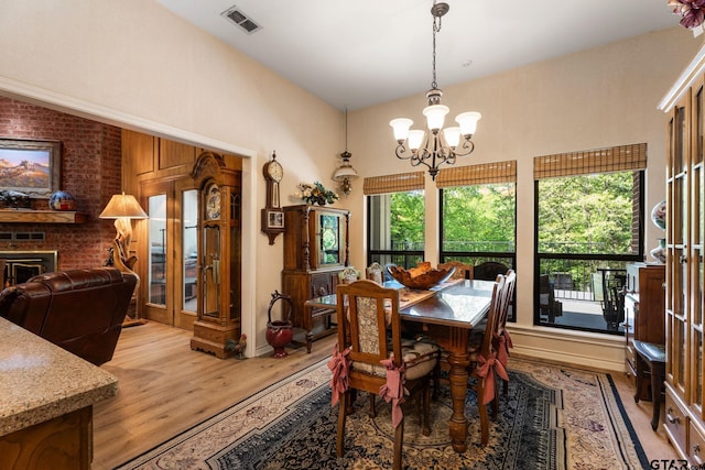 19132 Falls Creek Dr, Flint, TX 75762 - dining space featuring light wood-style floors, visible vents, and an inviting chandelier