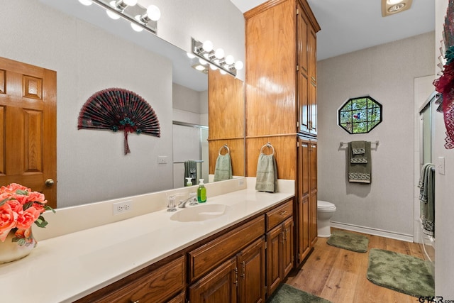 19132 Falls Creek Dr, Flint, TX 75762 - full bath with a shower stall, wood finished floors, toilet, vanity, and baseboards