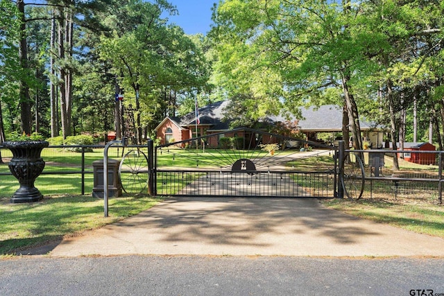 19132 Falls Creek Dr, Flint, TX 75762 - view of gate featuring fence and a yard