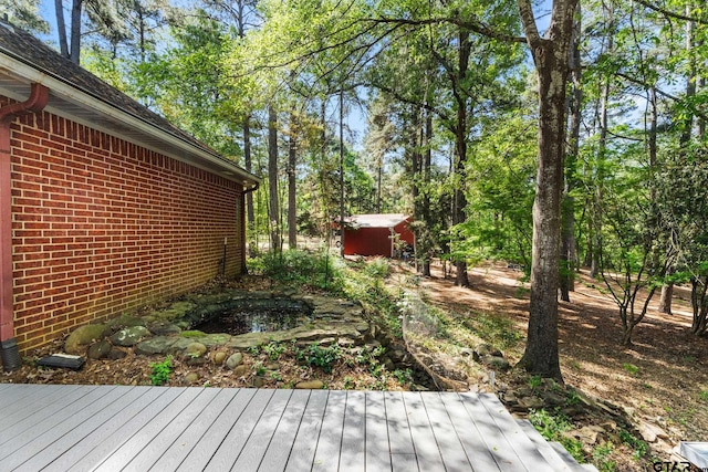 19132 Falls Creek Dr, Flint, TX 75762 - wooden terrace with an outdoor structure, a garden pond, and a shed