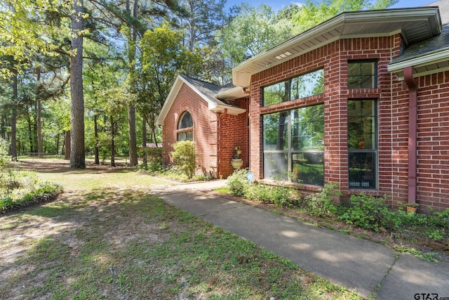 19132 Falls Creek Dr, Flint, TX 75762 - view of side of property featuring brick siding and roof with shingles