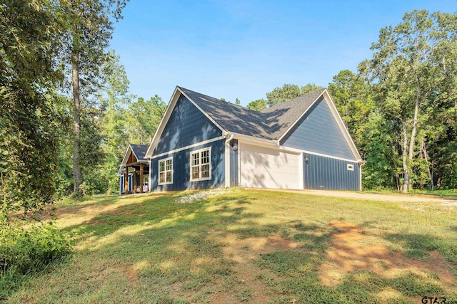 view of front of house with a garage and a front lawn