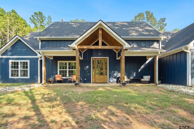 view of front facade featuring a front yard and a patio