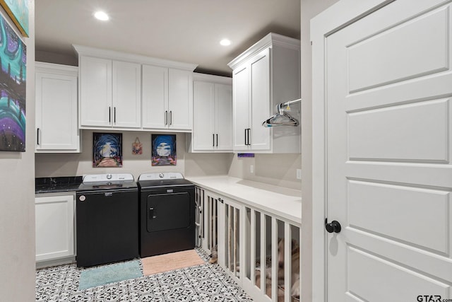 laundry area featuring cabinets and separate washer and dryer