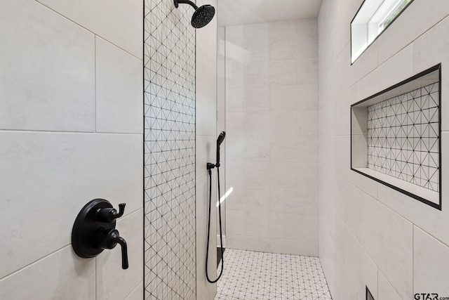 bathroom with tiled shower