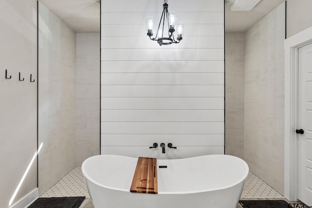 bathroom featuring tile patterned flooring and a tub