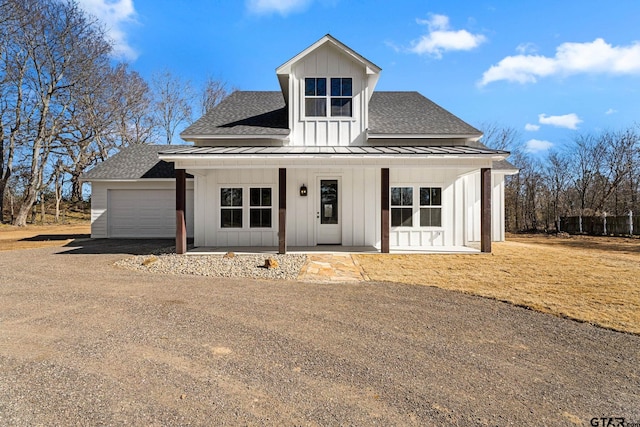 view of front of house featuring a garage and covered porch