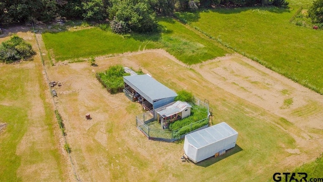 birds eye view of property with a rural view