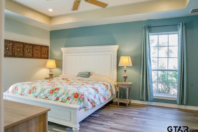 bedroom with recessed lighting, multiple windows, ceiling fan, and wood finished floors