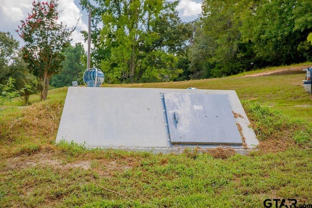 entry to storm shelter with a lawn