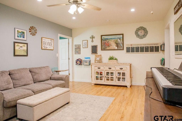 living area with ceiling fan, baseboards, light wood-style flooring, and recessed lighting